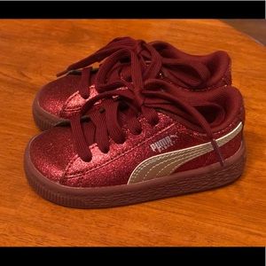 Red sparkly Puma sneakers